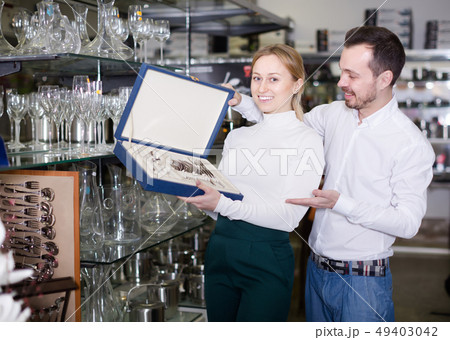 Adult couple choosing new cutlery 49403042