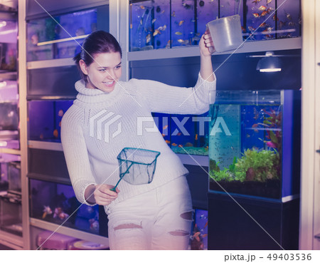 Girl watch at small fish Girl watch at small fish 49403536