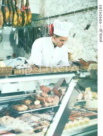 Young cook at butcher store 49404183