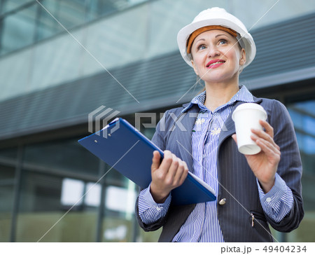 Professional woman in helmet working 49404234