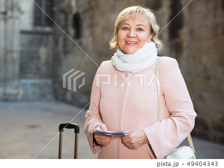 adult woman holding map guide adult woman holding map guide 49404343