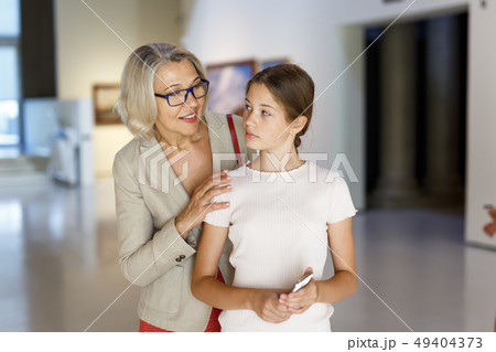 Woman and girl visiting museum 49404373