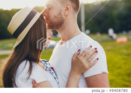 Beautiful couple spend time in a summer park 49408780