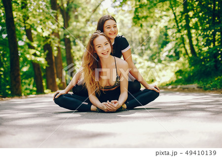 Sports girls in a park 49410139