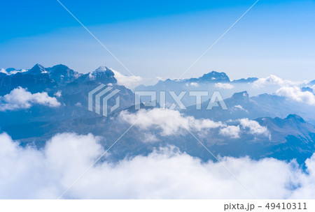 Silhouettes of the mountain in clouds Silhouettes of the mountain in clouds 49410311