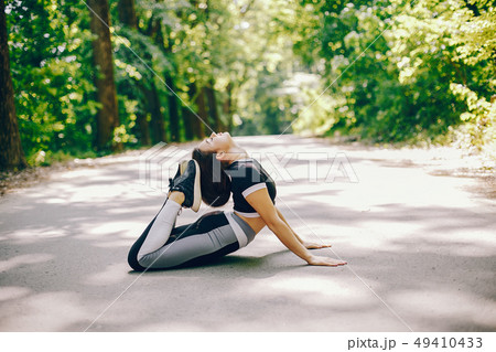 Sports girl in a park 49410433