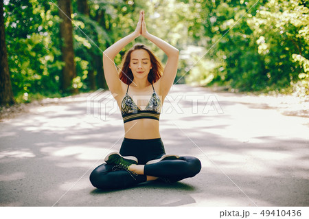 Sports girl in a park 49410436