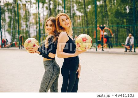 Sports girls in a park  49411102