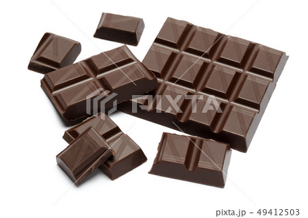 Dark organic chocolate pieces isolated on white background 49412503