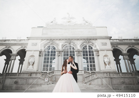 Perfect couple bride, groom posing and kissing in their wedding day Perfect couple bride, groom posing and kissing in their wedding day 49415110