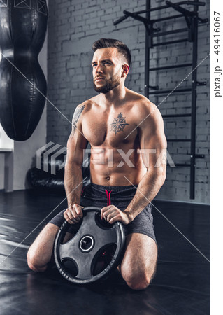 The athlete trains hard in the gym. Fitness and healthy life concept. 49416067