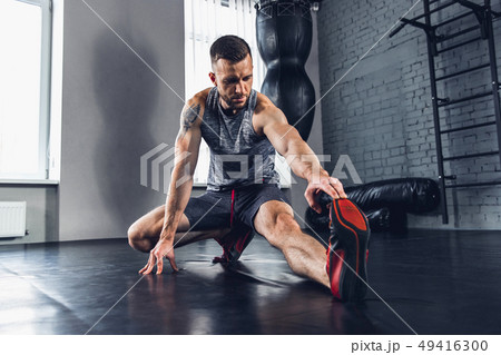 The athlete trains hard in the gym. Fitness and healthy life concept. The athlete trains hard in the gym. Fitness and healthy life concept. 49416300