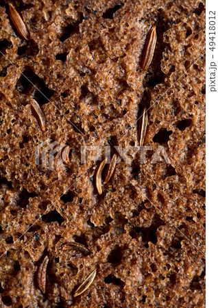 sesame seeds on black bread as a background 49418012