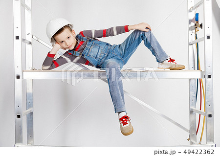 Boy builder in a helmet Boy builder in a helmet 49422362