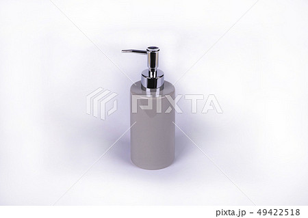 Dispenser for liquid soap on a light background. Dispenser for liquid soap on a light background. 49422518
