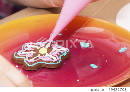 Decorating gingerbread cookies with icing, Decorating gingerbread cookies with icing, 49422703
