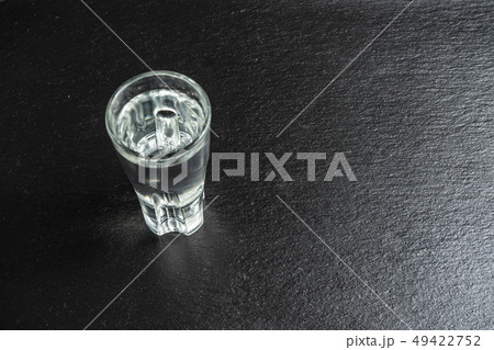 A shot of vodka. Stone background. Copy space,concept 49422752