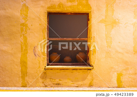 Old style pottery on the window background and Old style pottery on the window background and 49423389