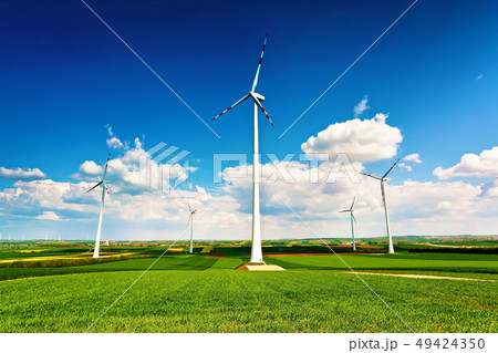 Spring sunny day, green fields. Wind turbines Spring sunny day, green fields. Wind turbines 49424350