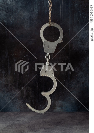 Open handcuffs hanging 49424647
