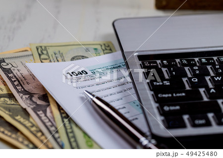 Tax Federal 1040 form with computer keyboard 49425480