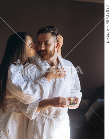 Happy couple enjoy each other's company in a hotel room. Happy couple enjoy each other's company in a hotel room. 49432937