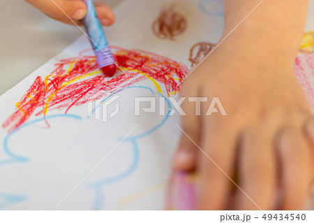Close up of little hands coloring with Crayon 49434540