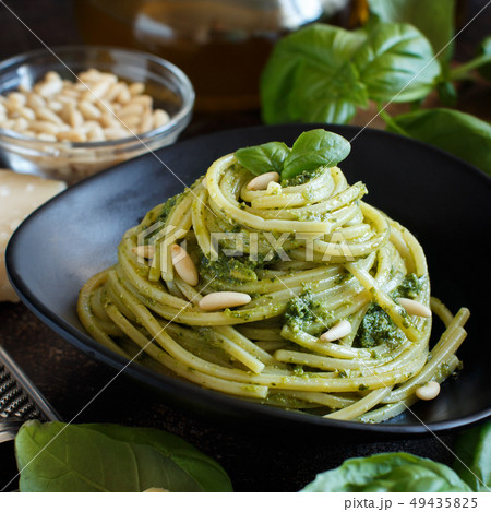 Spaghetti pasta with pesto sauce 49435825