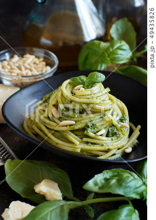 Spaghetti pasta with pesto sauce 49435826