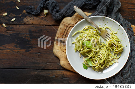 Spaghetti pasta with pesto sauce 49435835
