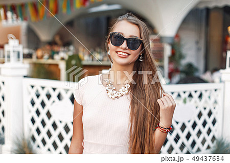 Portrait of beautiful cheerful girl in sunglasses Portrait of beautiful cheerful girl in sunglasses 49437634