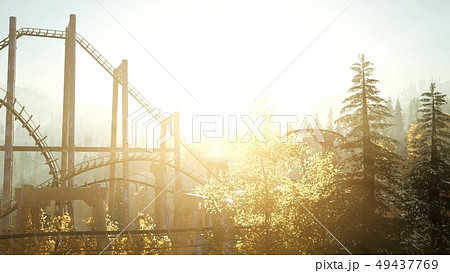 old roller coaster at sunset in forest 49437769