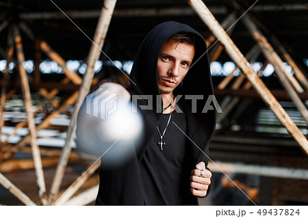 Aggressive man beats the bat. Stylish guy Aggressive man beats the bat. Stylish guy 49437824