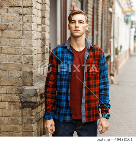 Handsome stylish man in fashionable checked shirt 49438161