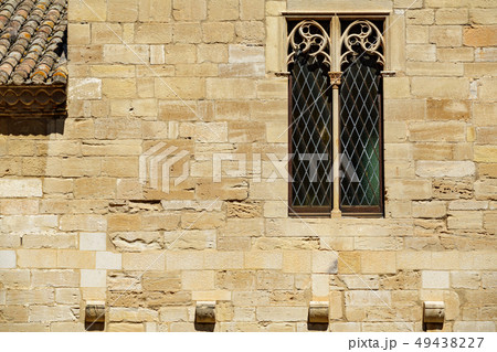 Background with antique window over strong stone wall Background with antique window over strong stone wall 49438227