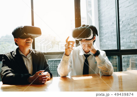 Two business business persons with virtual reality 49439874