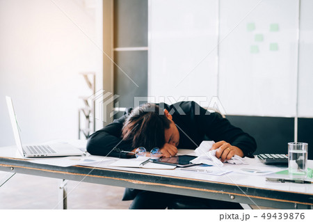 Employees are feeling tired while working. Employees are feeling tired while working. 49439876