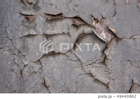 Old cracked paint on the concrete wall. Peeling paint on wall texture. Pattern of rustic blue grunge Old cracked paint on the concrete wall. Peeling paint on wall texture. Pattern of rustic blue grunge 49440862