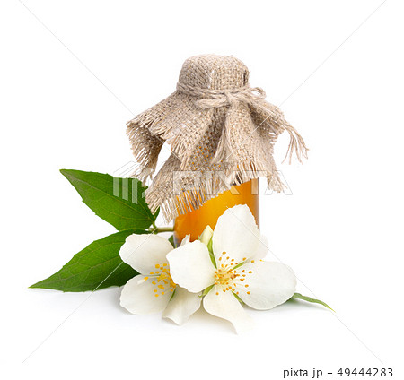 Flowers of a jasmine and pharmaceutical bottle. Flowers of a jasmine and pharmaceutical bottle. 49444283