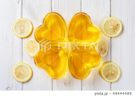 Yellow lemon jelly jello in heart shaped glass  49444489