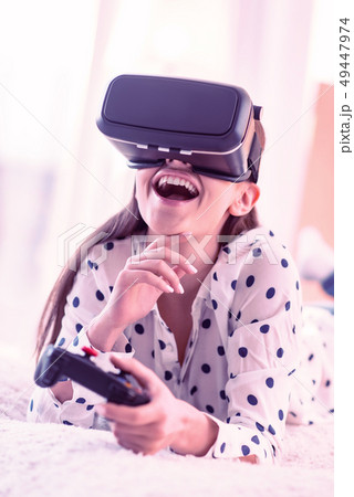 Joyful brunette laughing loudly at funny joke Joyful brunette laughing loudly at funny joke 49447974
