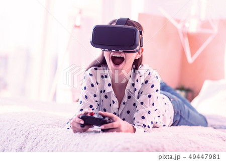 Positive delighted girl spending weekends with pleasure 49447981