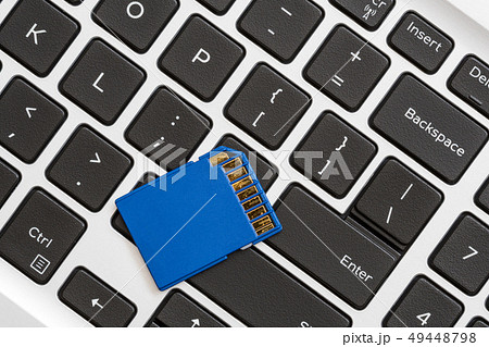 Blue SD memory card on the  keyboard 49448798