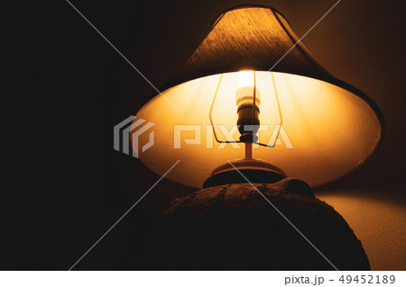 Livingroom lamp at night with dark background Livingroom lamp at night with dark background 49452189