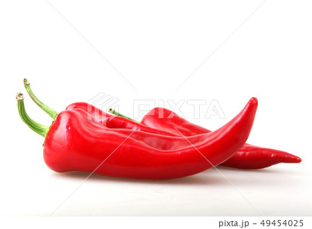 Close-Up Of Red Chili Pepper Against White Close-Up Of Red Chili Pepper Against White 49454025