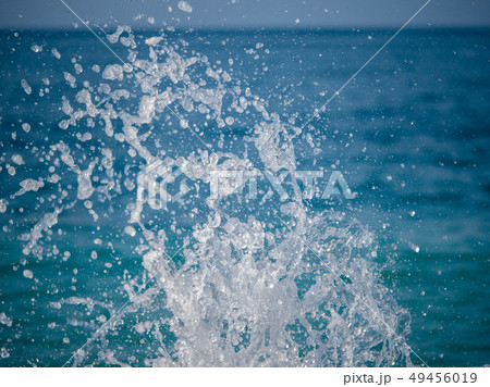 Splashes of water against the sea 49456019