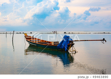 Fishing boat in the sea, sunset and silhouettes of 49463890