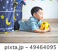 Happy little boy having fun with a play tent at 49464095