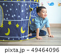 Happy little boy having fun with a play tent at 49464096