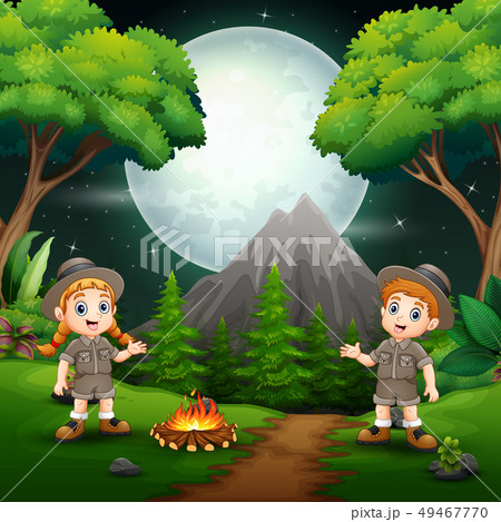 Happy scout boy and girl with a campfire at night 49467770